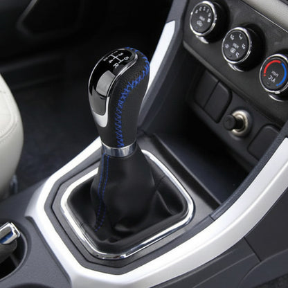 Pommeau de levier de vitesse avec surpiqûre contrastée bleu finition soignée et durable